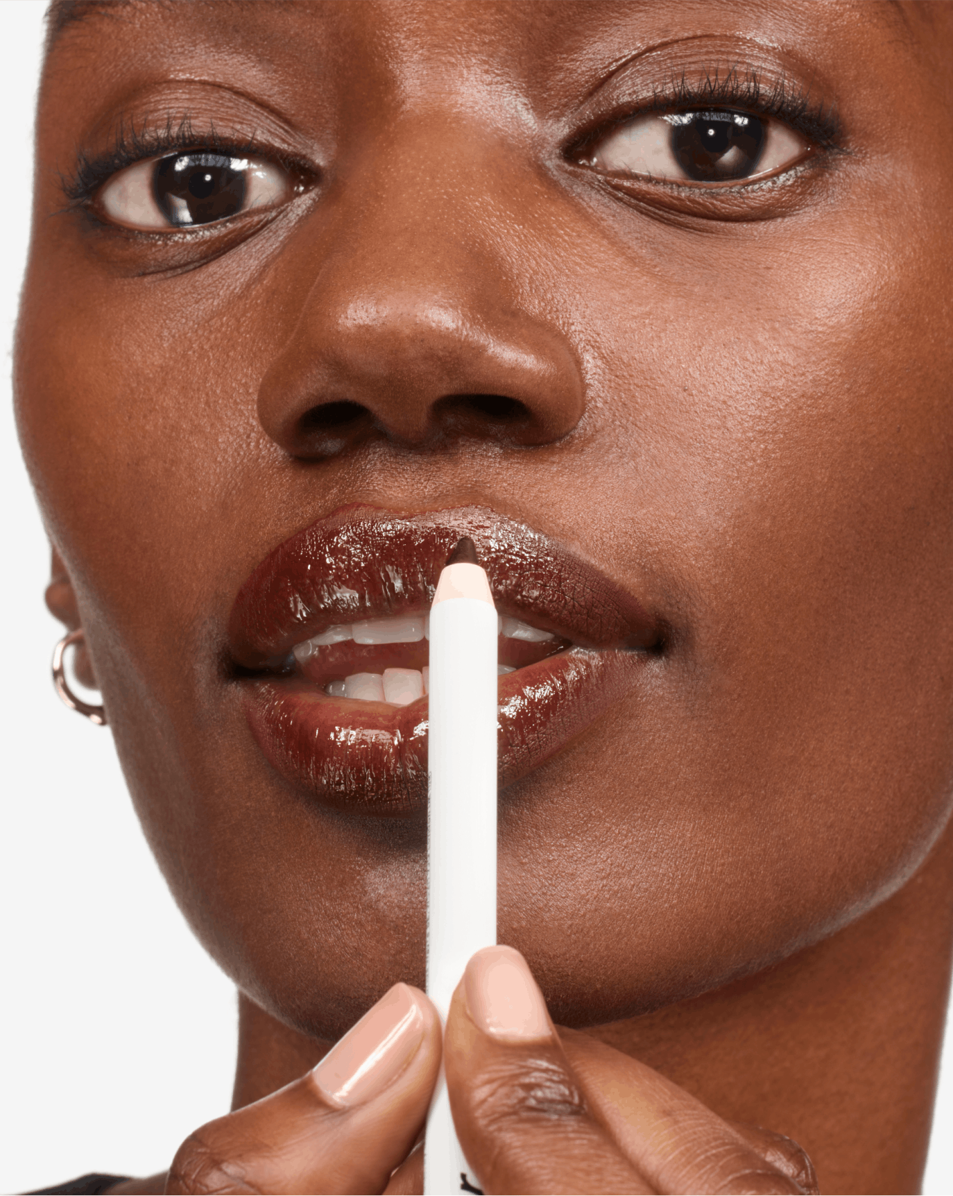 Brenda wears Lip Line in Bare.