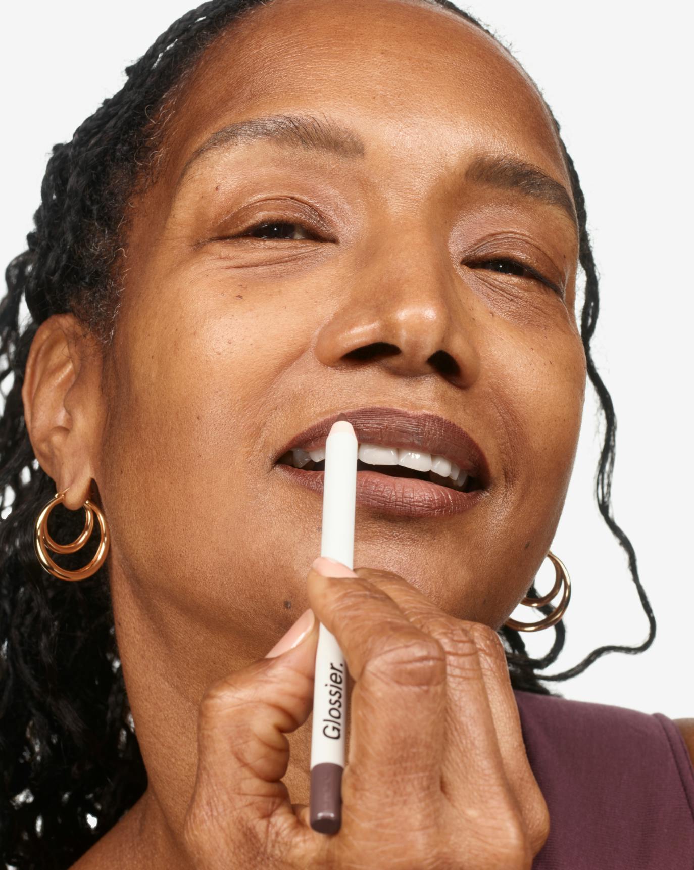 Cynthia wears Lip Line in Nip.