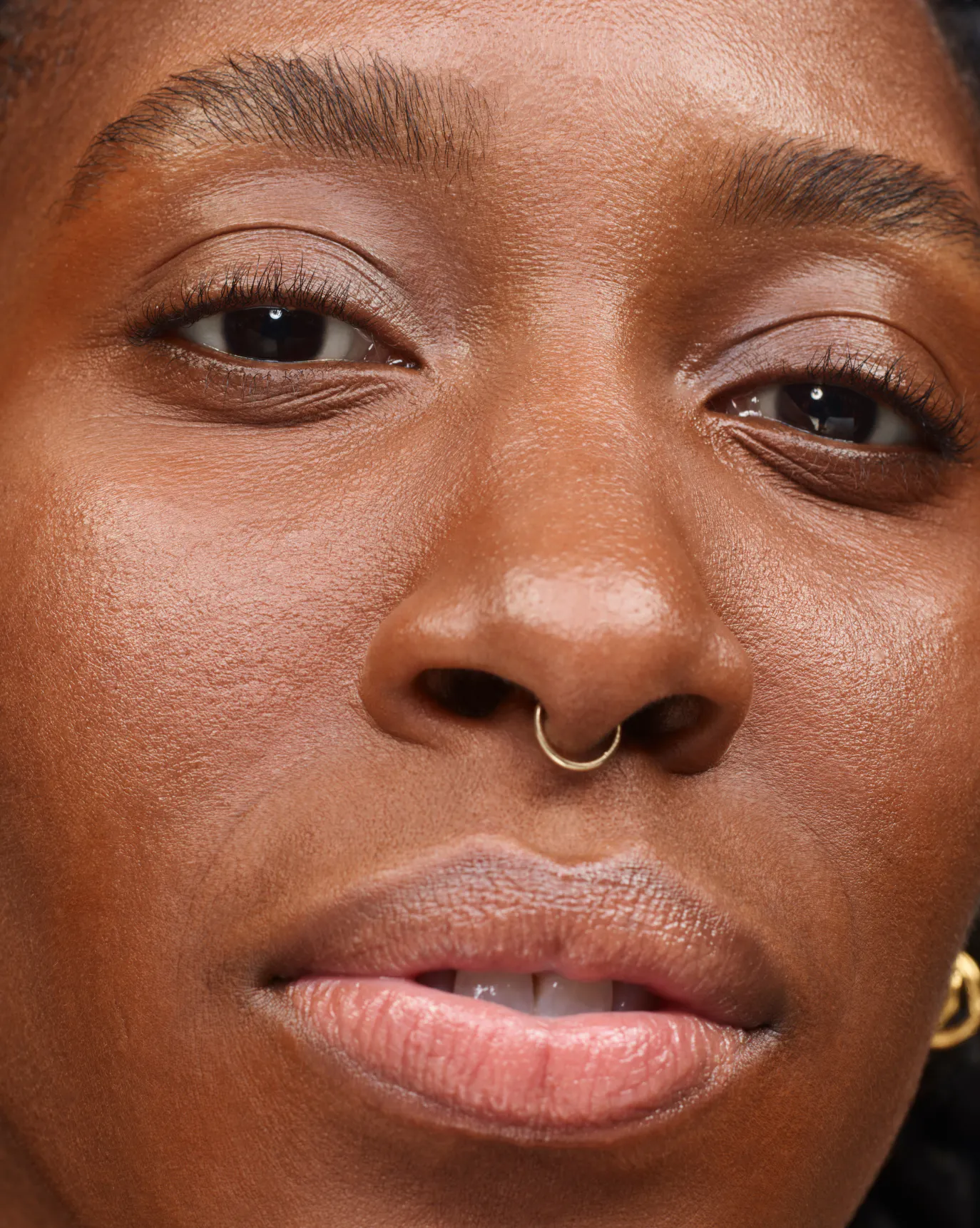 Funmi in Stretch Balm Concealer, D4.