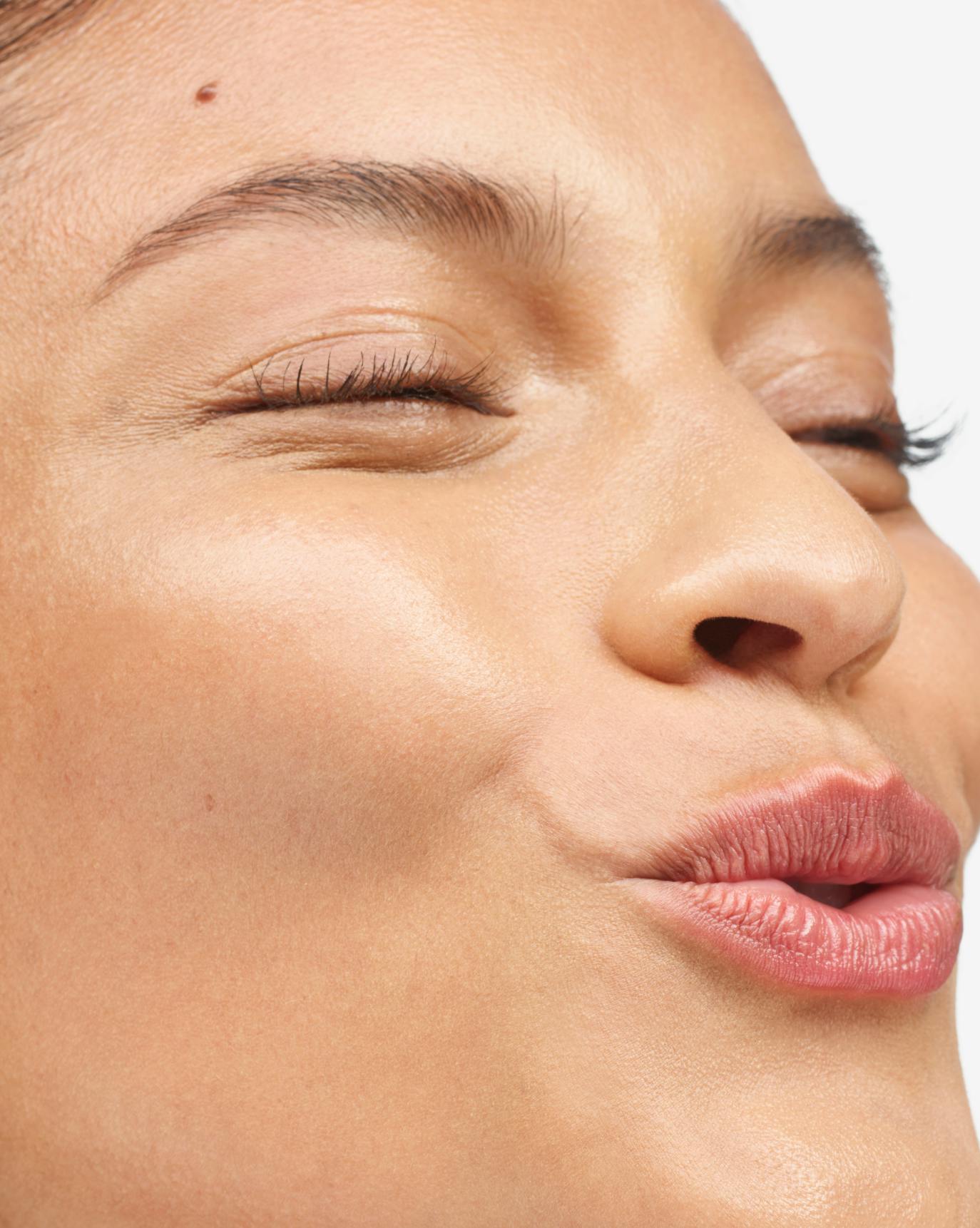 Nina in Stretch Balm Concealer, MT1.