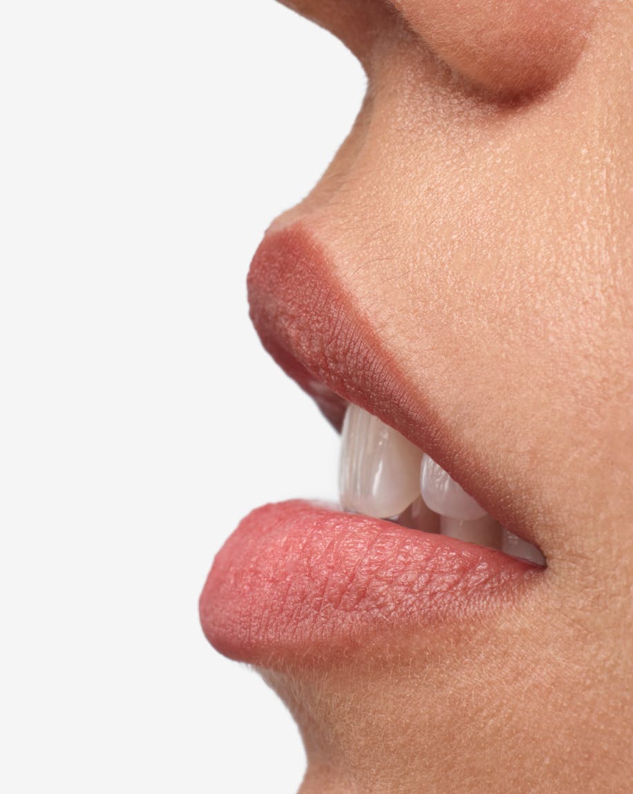 close up of profile view of model's mouth wearing generation g in fuzz