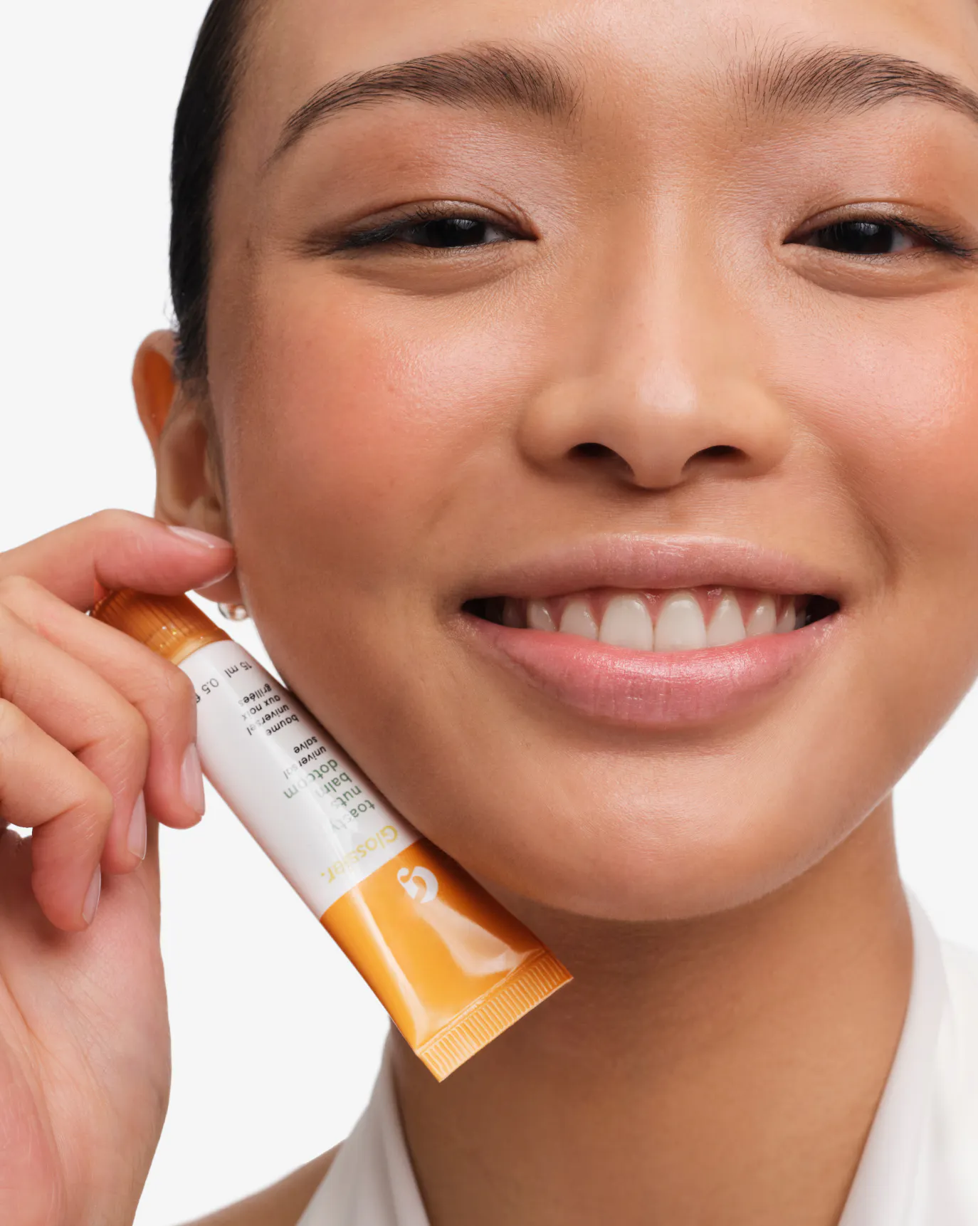 Joy wears Toasty Nuts Balm Dotcom.