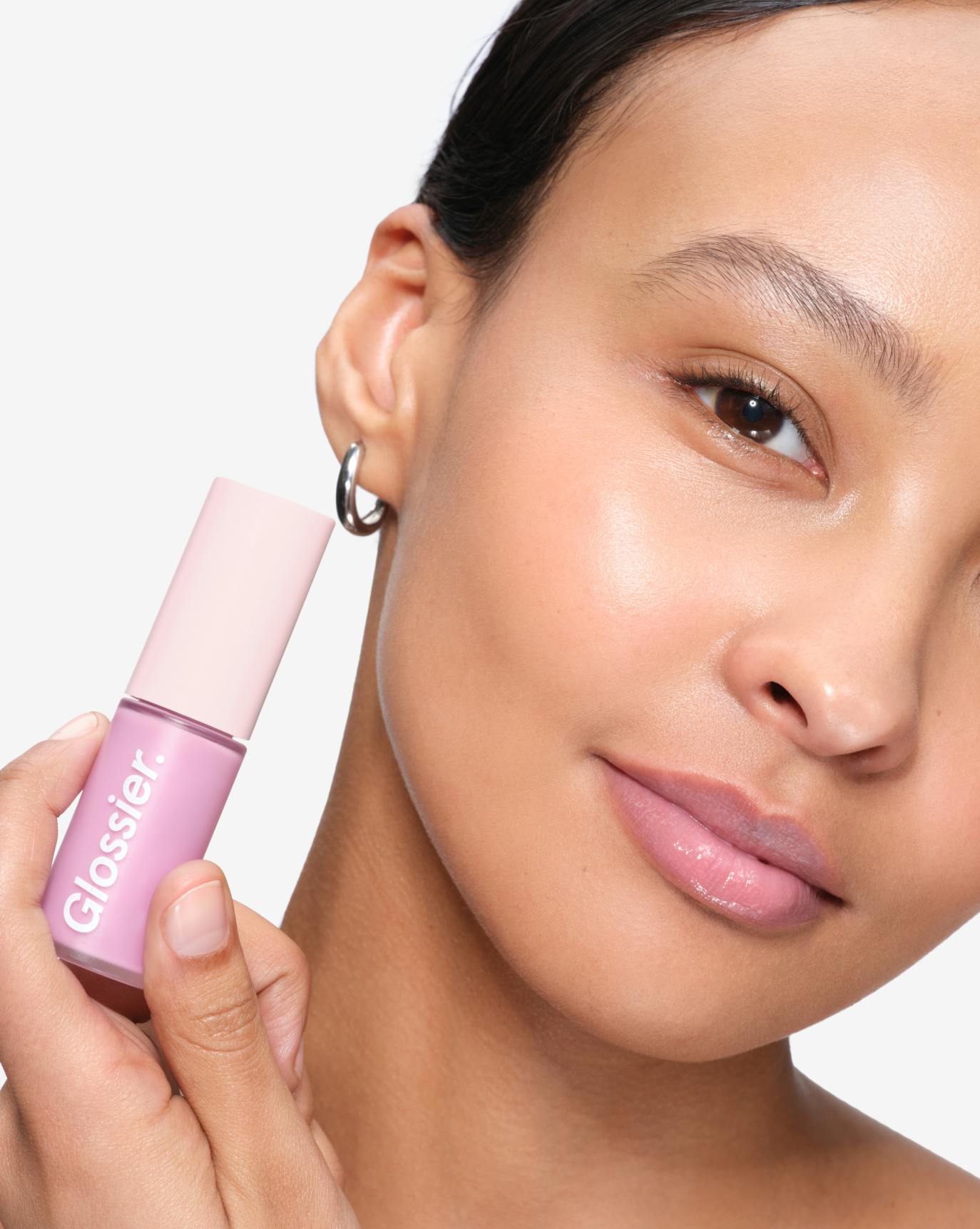 Edna wears Lip Glaze in Frosty.