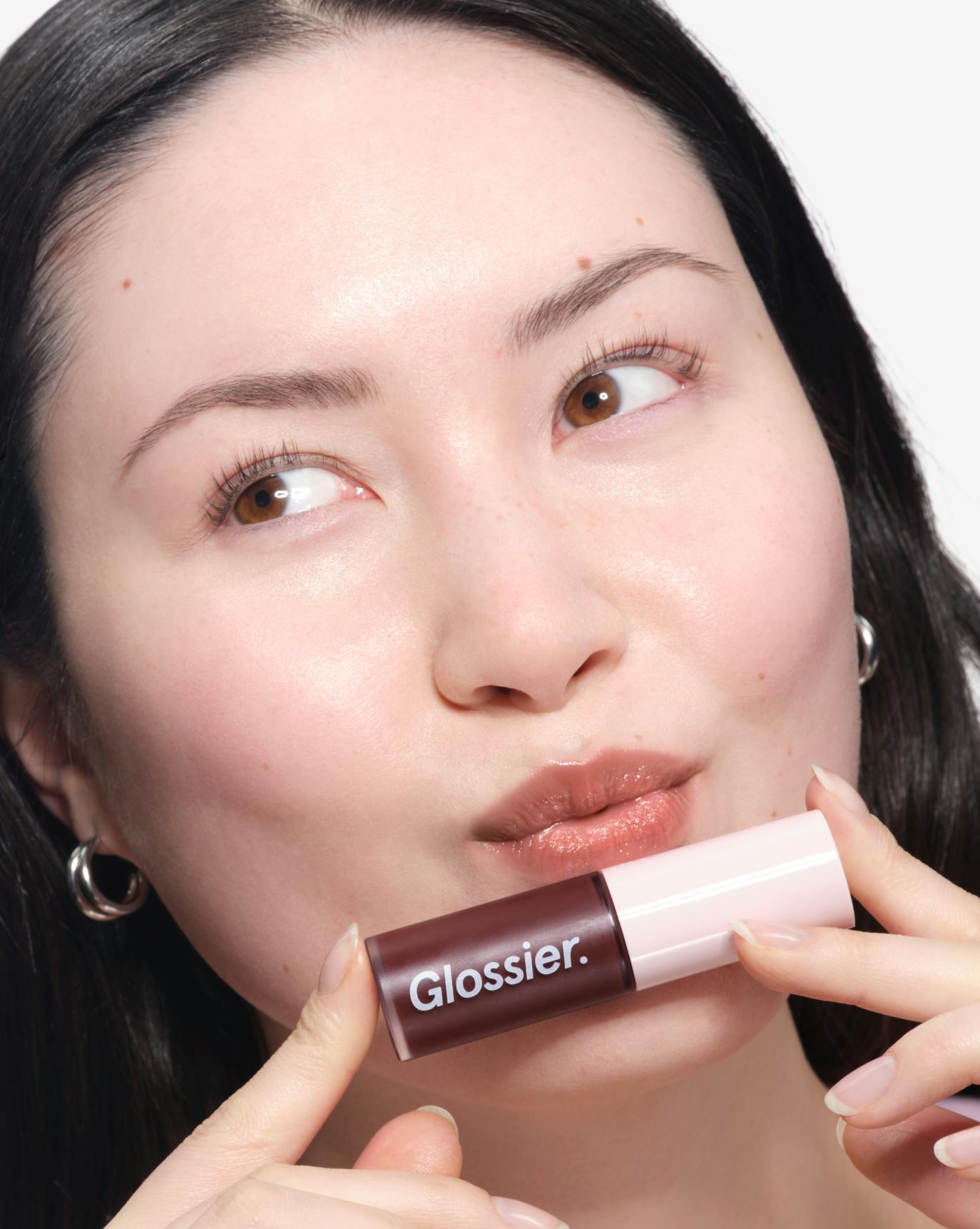 Tallulah wears Lip Glaze in Melty.