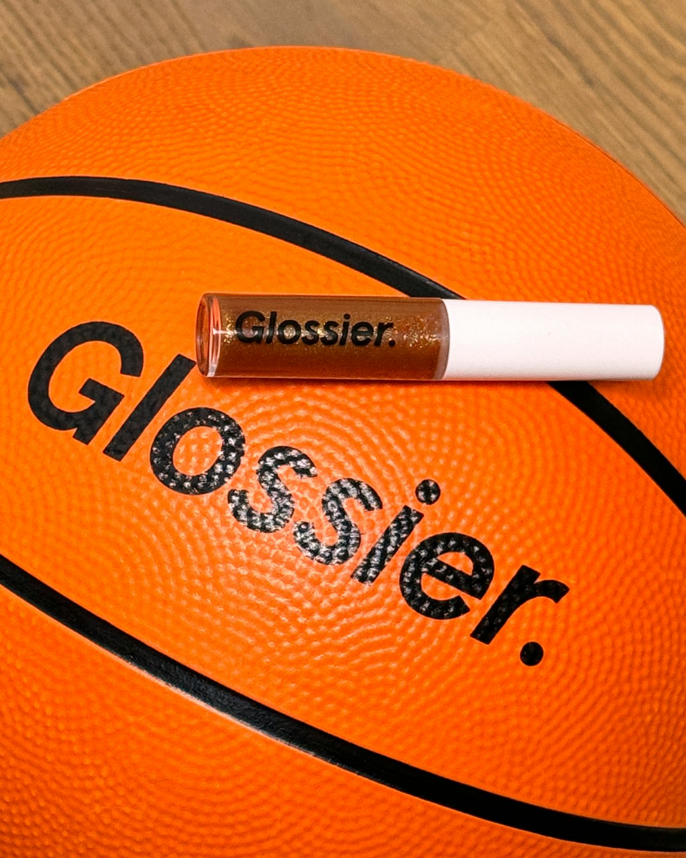 Tess wears Lip Gloss in Bronze