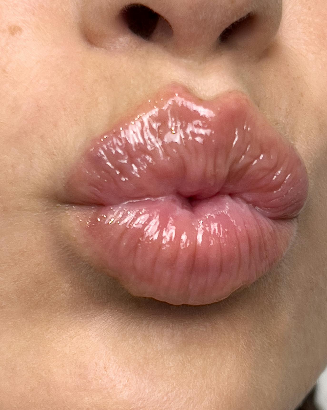 Soap wears Lip Gloss in Brown