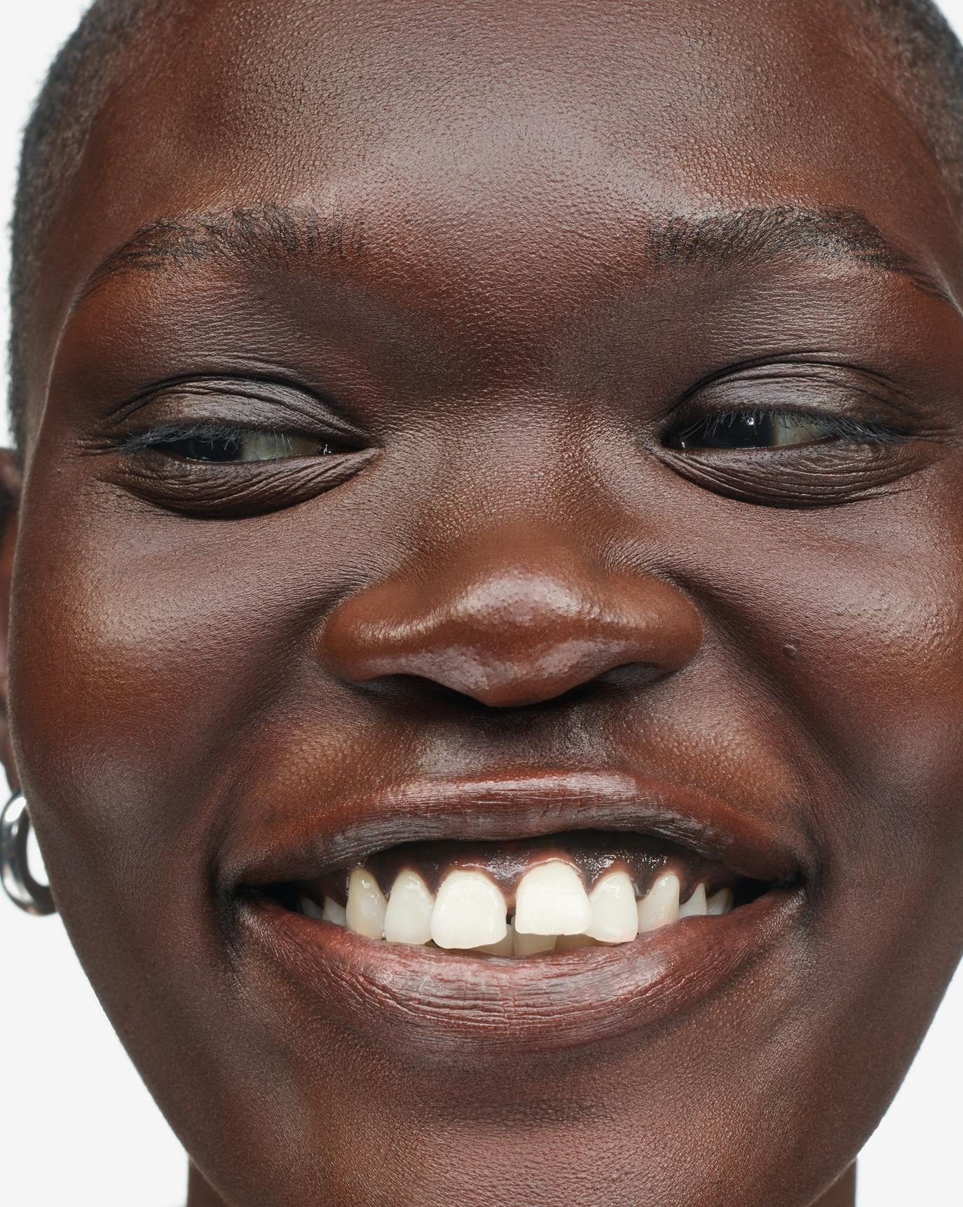 Nanny wears Stretch Fluid Foundation in Very Dark 4.