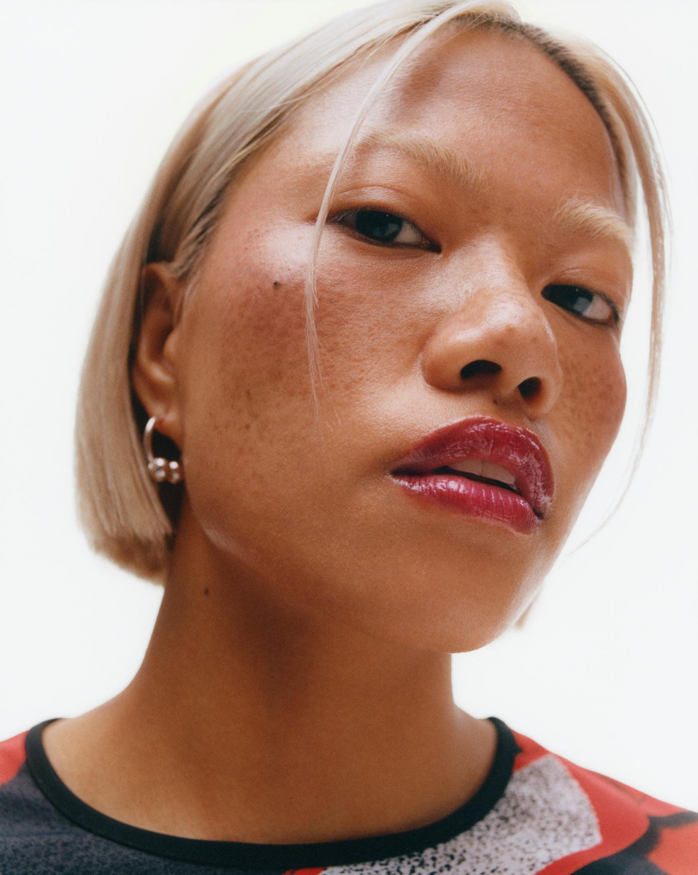 Jael wears Ultralip in Cranberry.