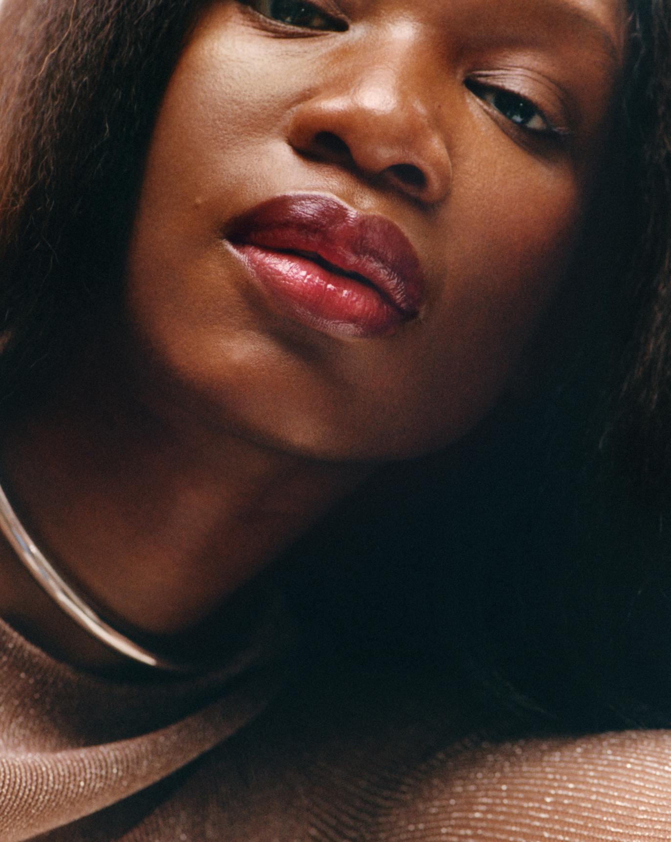 Marie wears Ultralip in Cranberry.