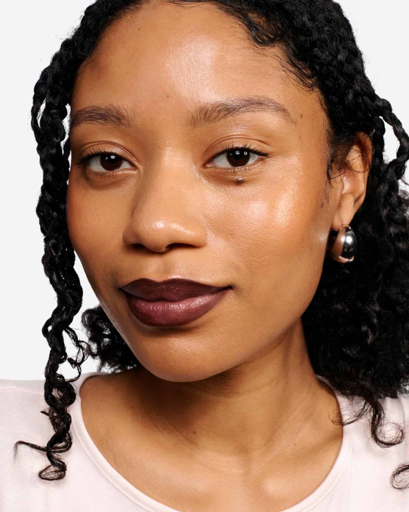 Naome wears Lip Line in Bare and Ultralip in Ember.