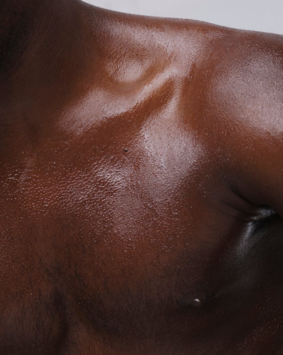 close up of model wearing body touch dry oil mist