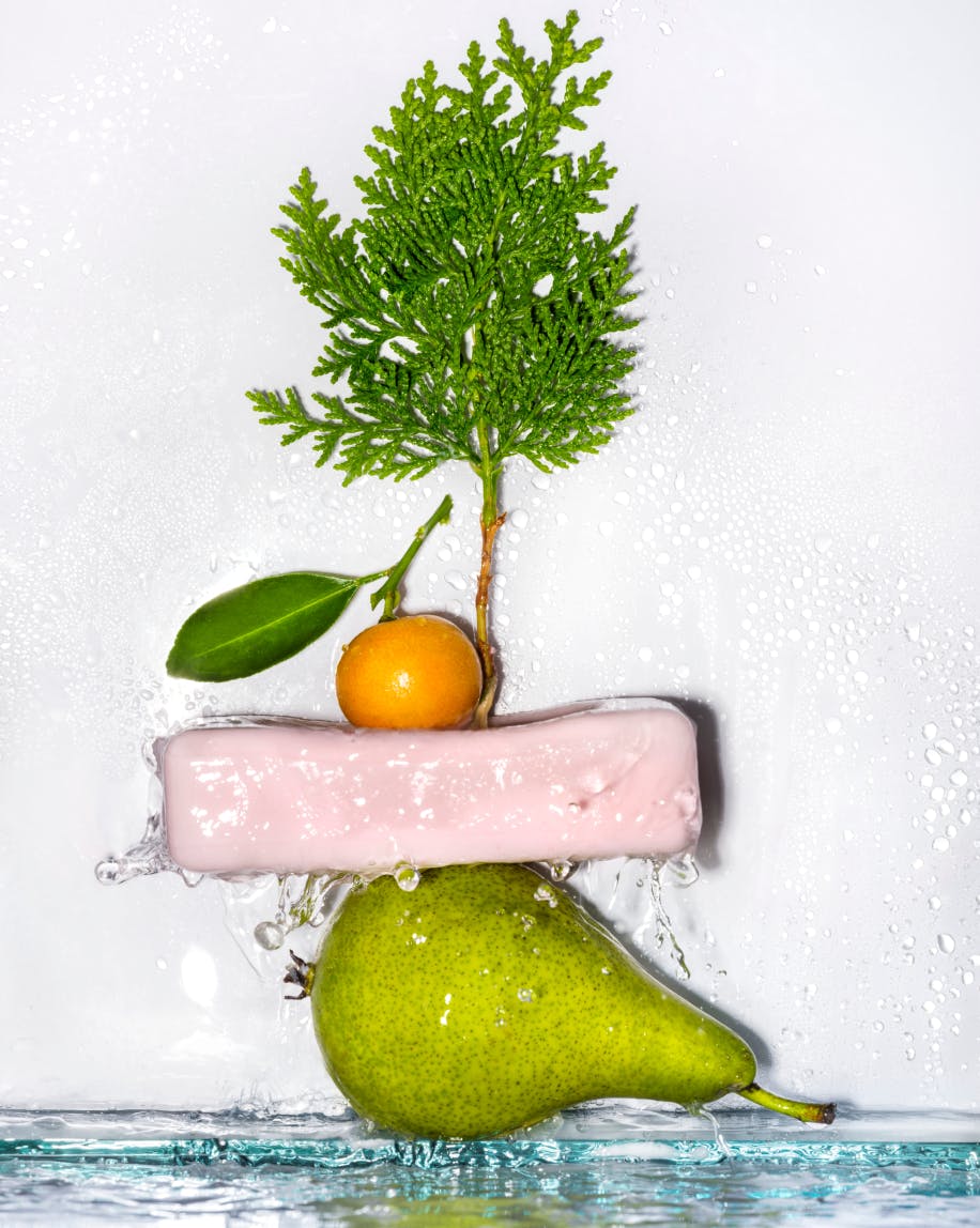 The Exfoliating Bar stacked on various fruit.