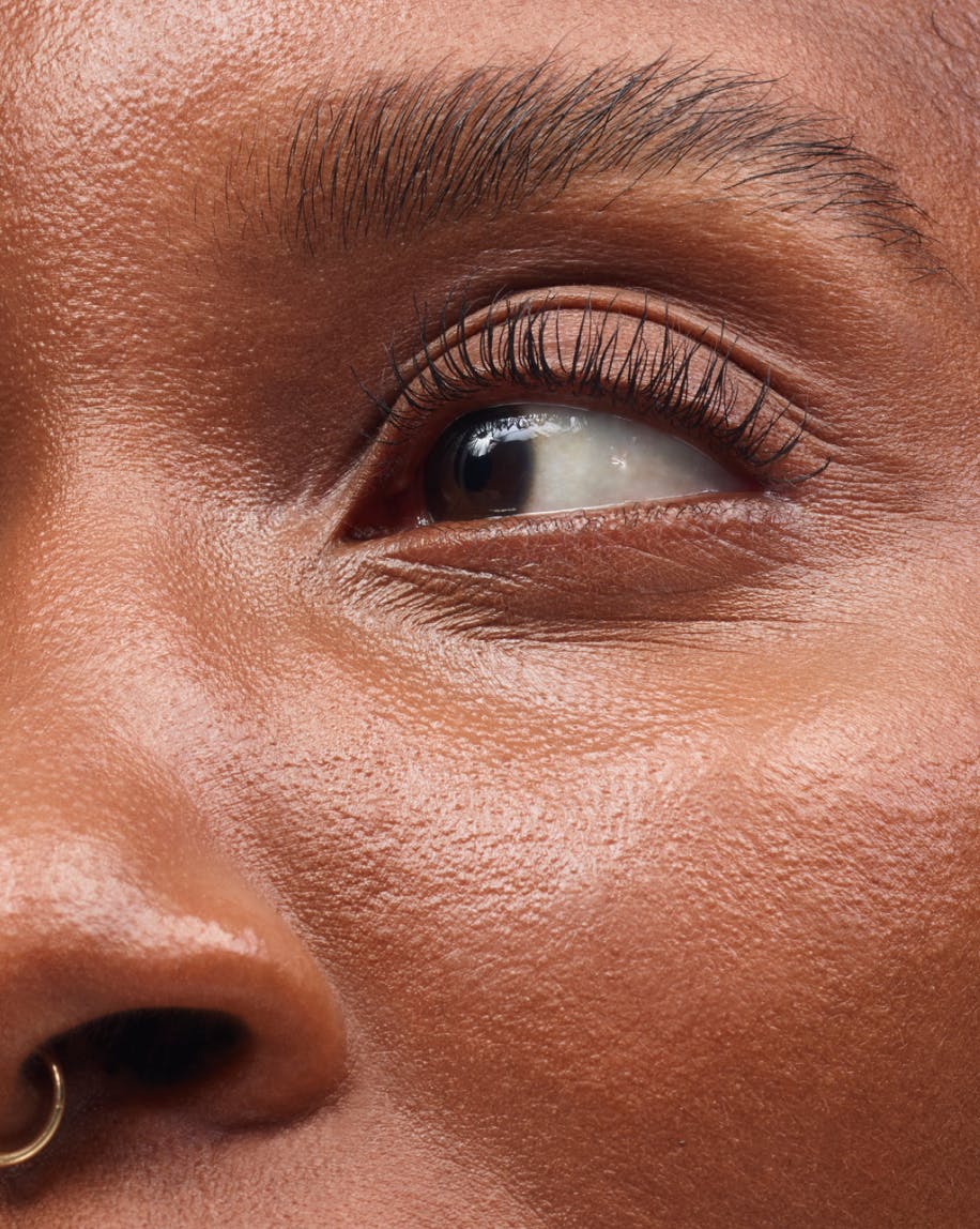 close up of eye wearing lash slick black on eyelashes