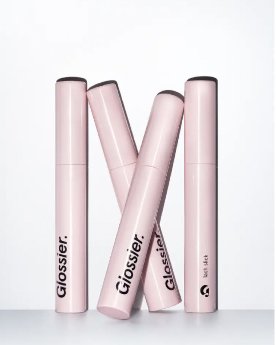 4 closed tubes of lash slick against white background