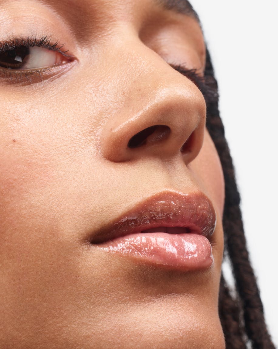 model wearing holographic lipgloss