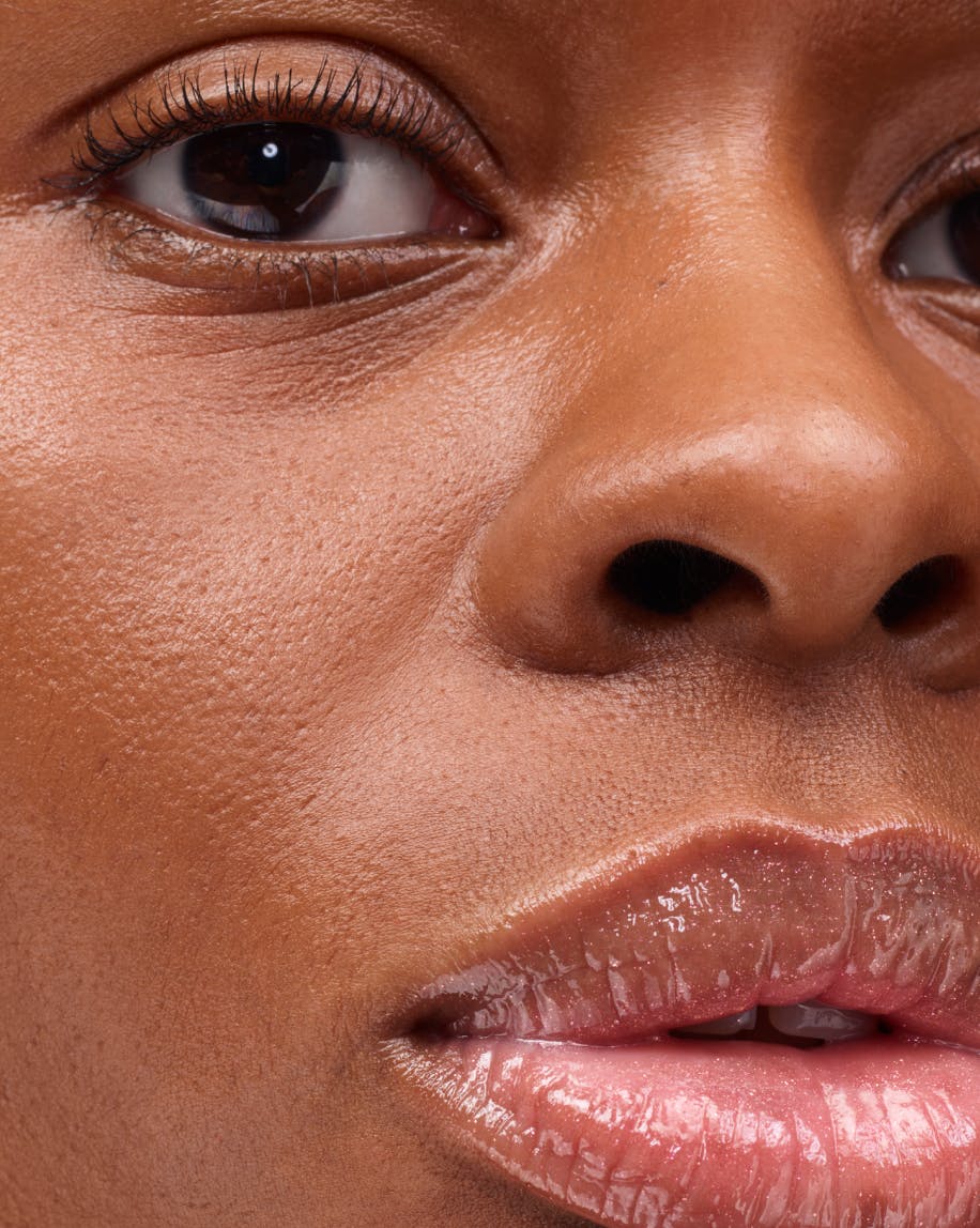 up close shot of model wearing holographic lipgloss