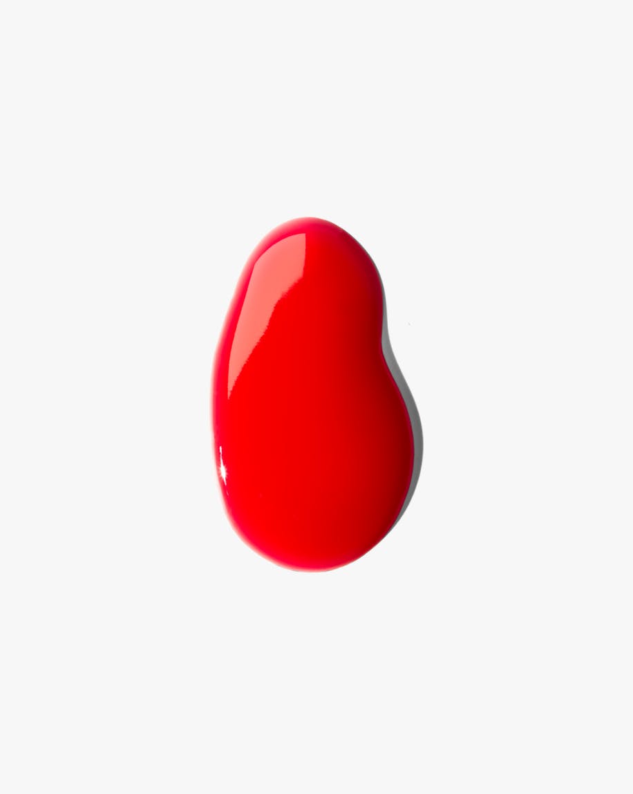 swatch of lipgloss in red against white background