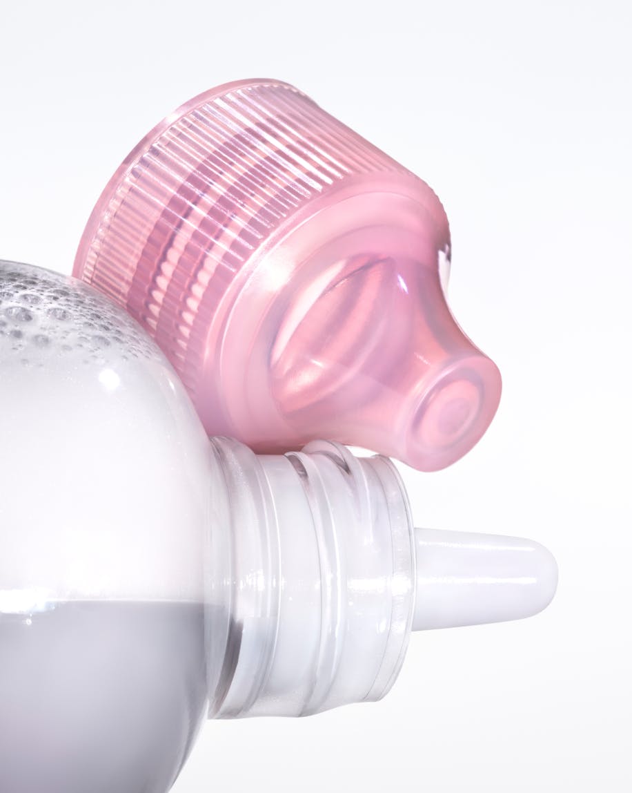 Top of Milky Oil bottle and cap