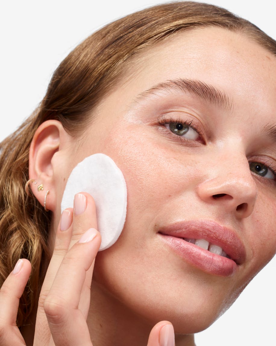 Olivia uses Milky Oil with a cotton pad to remove makeup.