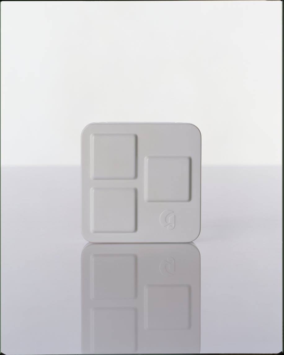 product packaging of monochromes against white background