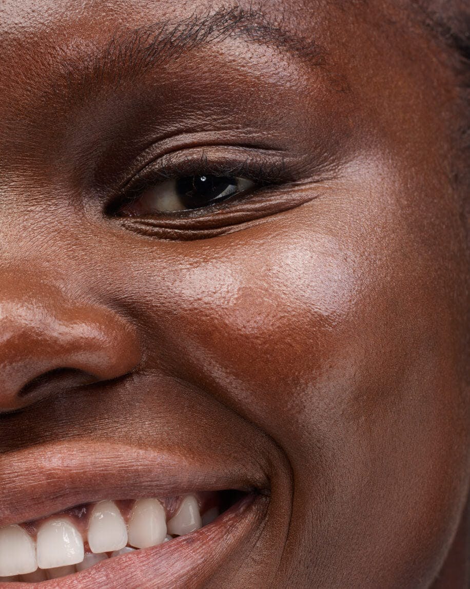 close up of model's cheek wearing haloscope in quartz