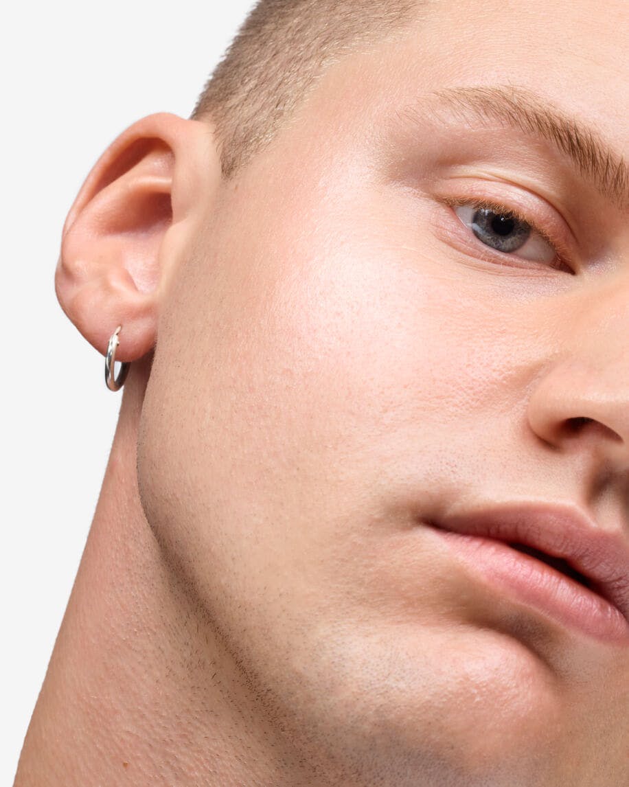 close up of model's cheek wearing haloscope in quartz